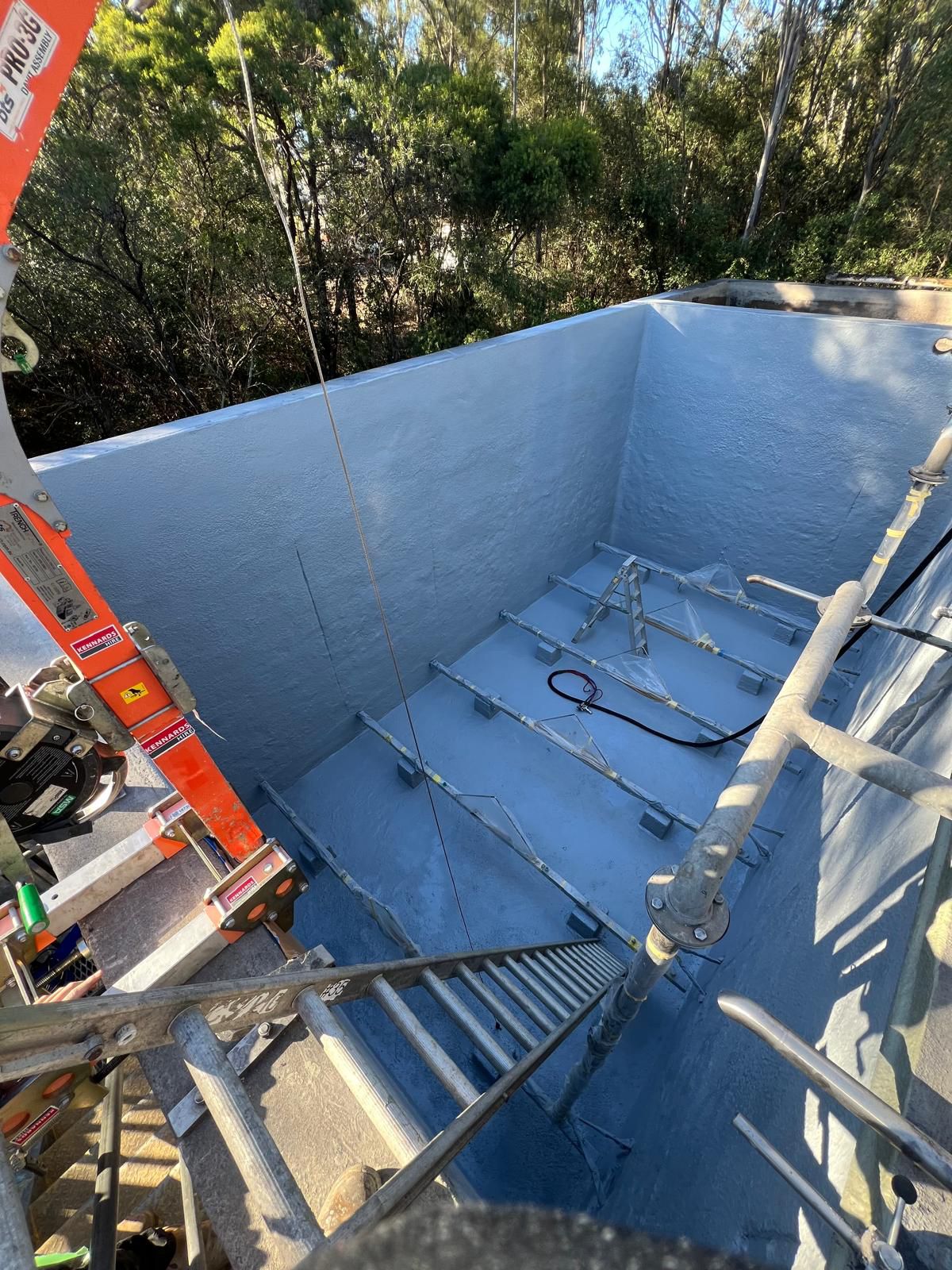 Industrial protective coating — polyurea lined pit for manufacturing facility