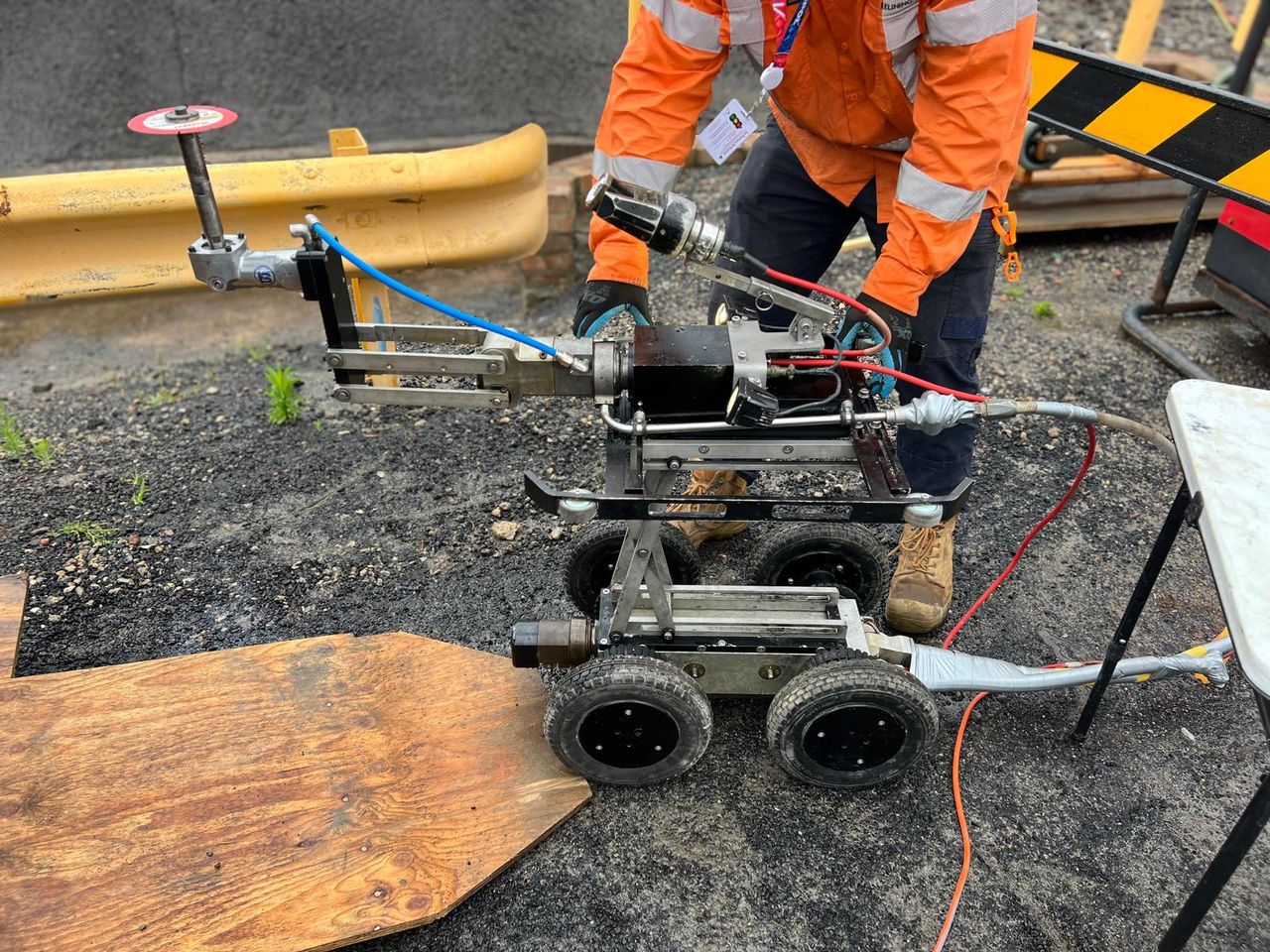 Inspection and assessment — robotic CCTV crawler being prepared for pipeline inspection