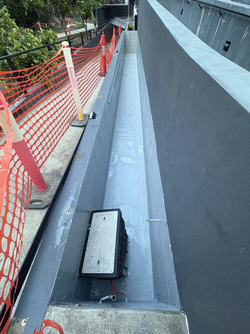 Commercial planter box sealed with seamless protective membrane in Southport Queensland